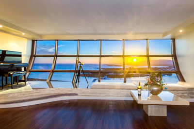 One Waterfront Tower Condo - living room sunset view